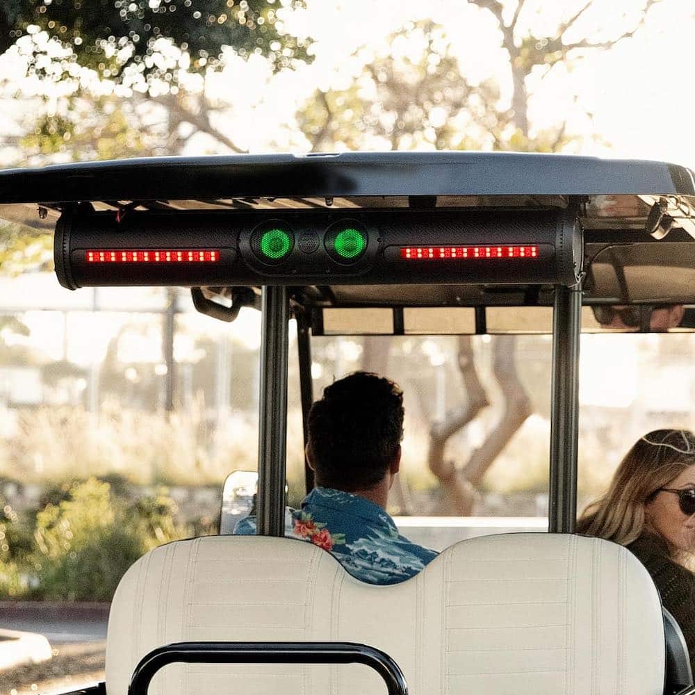 Exogear Soundbar with green lights and brake lights installed on golf cart roof