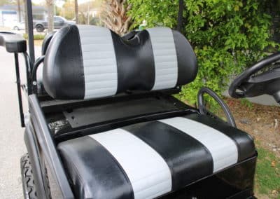 Custom black golf cart seats with white stripes