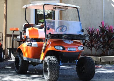 An EZ Go cart with custom paint and wrap and orange seats for Clemson fans